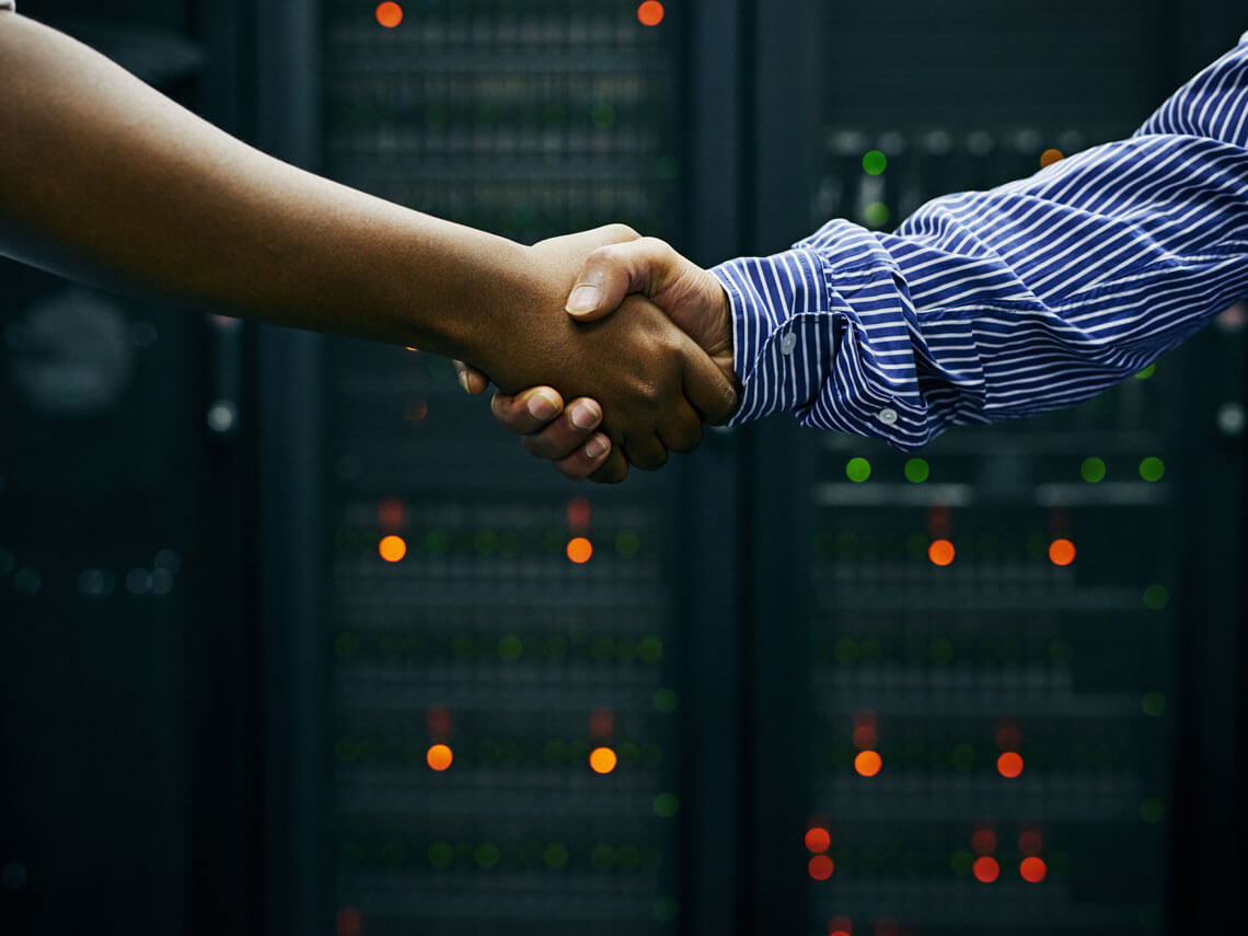 Two men shaking hands. business agreement for IT services